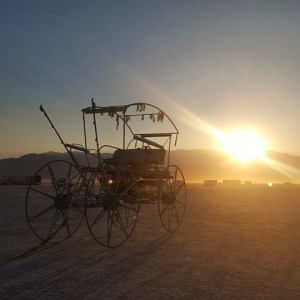Spoono's art car at sunrise after early man. I will miss seeing him riding around on playa